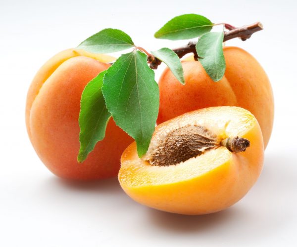 12521444 - apricots with leaves on white background, isolated